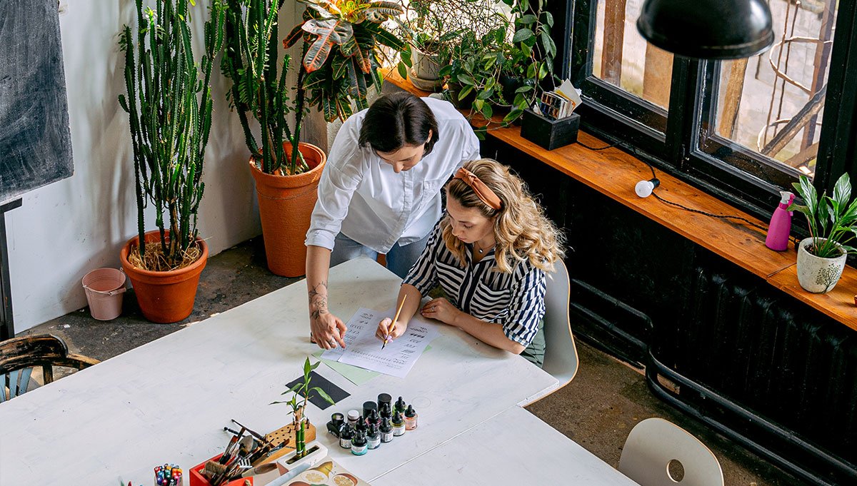Two women working Two women working